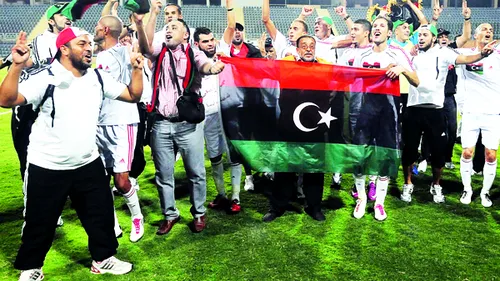 De pe teren pe front!** Și iar pe teren! Povestea fotbalului libian până la moartea lui Gaddafi