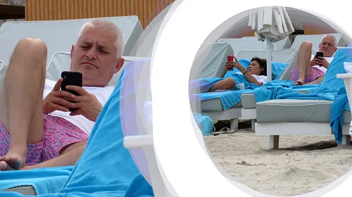 Virgil Ianțu și soția, plictiseală maximă la plajă! Au stat cu ochii doar în telefoane și s-au ignorat