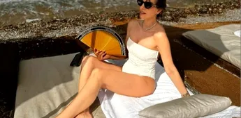 Prezentatoarea DigiSport, apariție fierbinte pe Coasta de Azur, într-un costum de baie alb! Simona Țăranu și-a etalat formele la doi pași de paradisul milionarilor din Monaco. GALERIE FOTO