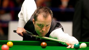 John Higgins**, noul campion mondial la snooker